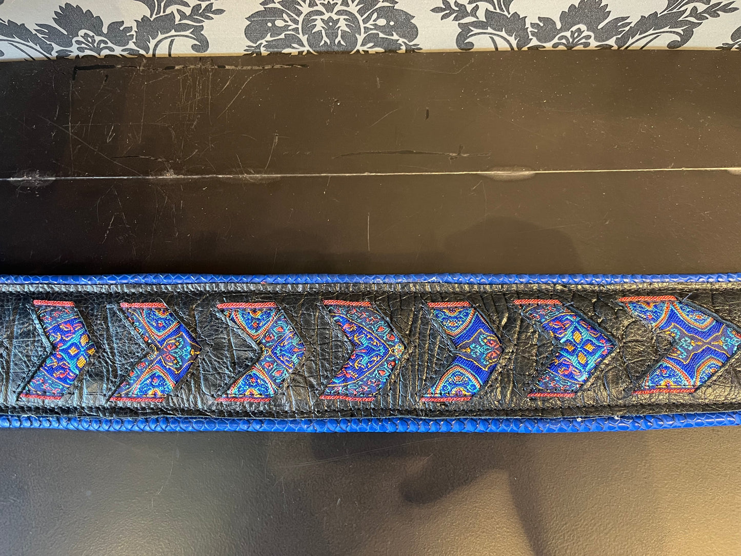 Ferrini Hand Made Leather Guitar strap Black Robusto With Cut outs with bright indian trim and blue piping